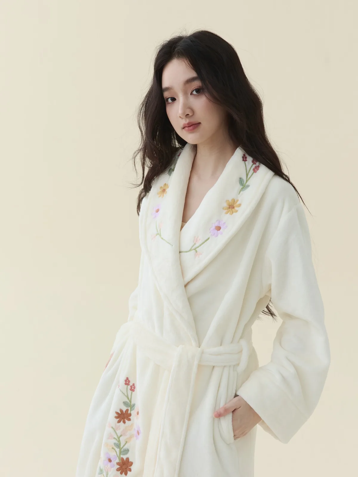 Close-up of embroidered plush fleece at the shawl collar